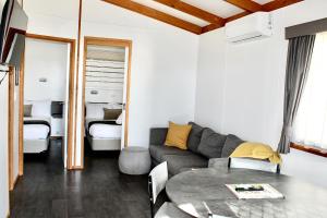 a living room with a couch and a table at BIG4 Rutherglen Holiday Park in Rutherglen