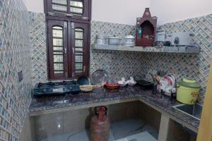 a kitchen with a sink and a counter top at Prakriti Awas Homestay in Jāmb