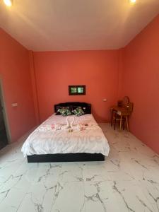 Ένα ή περισσότερα κρεβάτια σε δωμάτιο στο Captain Homestay