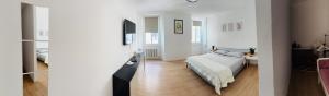 a bedroom with a bed and a desk in a room at Casa Bors in Riva del Garda +23 photos