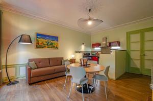 a living room with a couch and a table at A l'ombre de la cathedrale in Troyes +8 photos