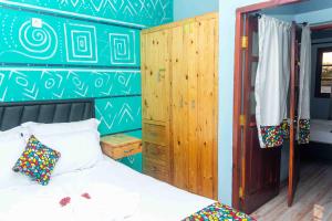 Postel nebo postele na pokoji v ubytování Ayira Casa Azul