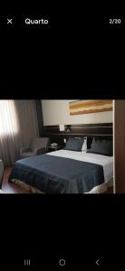 a picture of a bedroom with a bed and a chair at Suíte em Hotel de Luxo Bourbon in Belo Horizonte +16 photos