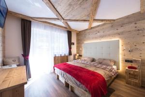 Postel nebo postele na pokoji v ubytování Alpstyle Hotel Albolina Wellness & Beauty