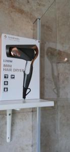 a box of a hair dryer sitting on a shelf at Mary's Place in Plumstead +19 photos