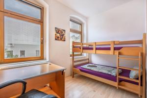 En eller flere senge i et værelse på Wohnen in 09599 Freiberg