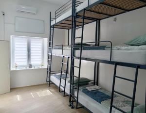 a room with four bunk beds and a window at Жути Ранац - Žuti Ranac - Yellow Backpack in Boljevac