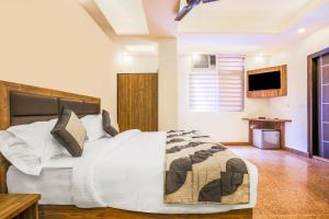 Ένα ή περισσότερα κρεβάτια σε δωμάτιο στο Embellish Inn +18 φωτογραφίες