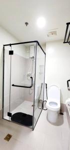 a bathroom with a shower and a toilet at LG318 New Brenthill Premium Condo near SMBaguio in Baguio