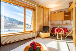a room with a window with a view of a mountain at G3 appartamento 21 Pila- Gressan in Pila