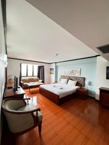 Ένα ή περισσότερα κρεβάτια σε δωμάτιο στο Omni Tower Nana- Fully Furnished Apartments Bangkok