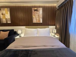 Giường trong phòng chung tại Hotel-like Entire Unit at Fame Residences