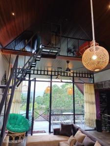 a living room with a staircase and a couch at Villa Mount View in Gampola +17 photos
