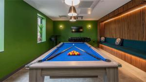 a pool table in a room with green walls at Students Only Straits Egham - 40 mins to Waterloo - Direct Bus to Heathrow in Egham
