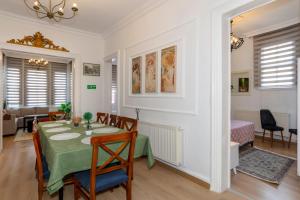 a dining room with a table and a bedroom at The Heaven on Heritage Street in Istanbul