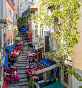 an alley in the city with tables and chairs at The Heaven on Heritage Street in Istanbul