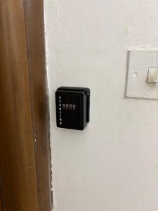 a black door knob on a white door at Double bedroom with private bathroom in Pieta