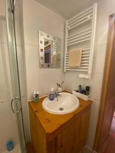 a bathroom with a sink and a mirror at Jardin des Neiges - 11A in Samoëns +7 photos