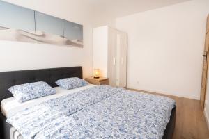 Ένα ή περισσότερα κρεβάτια σε δωμάτιο στο Apartament u Kasi