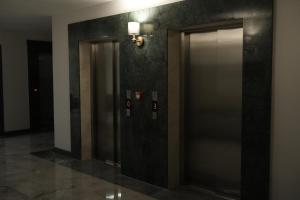 a elevator lobby with two elevators in a building at Rest By Dedeman Sapanca in Sapanca