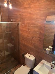a bathroom with a toilet and a shower and a sink at Double bedroom with private bathroom in Pieta +2 photos