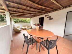 a wooden table and chairs on a patio at Casa Blanca in Socorro