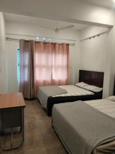 En eller flere senge i et værelse på Windy MOUNTAIN