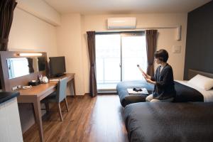 TV a/nebo společenská místnost v ubytování Hotel Trad