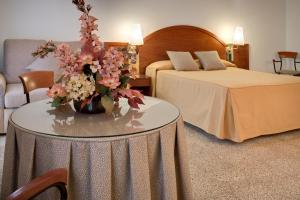 Postel nebo postele na pokoji v ubytování Hotel Gaudi