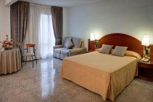 Postel nebo postele na pokoji v ubytování Hotel Gaudi