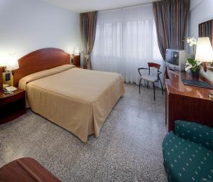 Postel nebo postele na pokoji v ubytování Hotel Gaudi