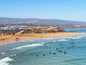 a group of people in the water at a beach at Horizon Atlantic View in Agadir
