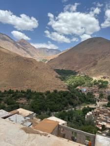 a view of a village in a mountain valley at Berber lodge amssouzart in Tizgui