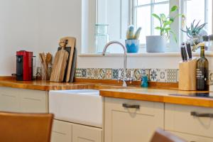 a kitchen counter with a sink and a window at 6 Angel Hill, Bury st Edmunds in Bury Saint Edmunds +37 photos