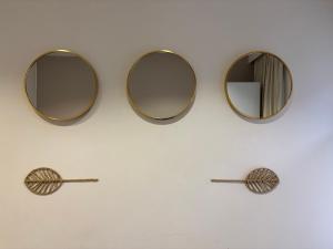 a pair of mirrors hanging on a wall at Luxury Suite - Amsterdam Lounge in Amsterdam