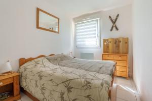 Postel nebo postele na pokoji v ubytování Résidence Le Printemps - Appt vue montagne