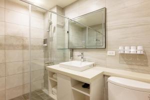 a bathroom with a sink and a mirror and a toilet at 九份觀海樓民宿 in Jiufen +38 photos