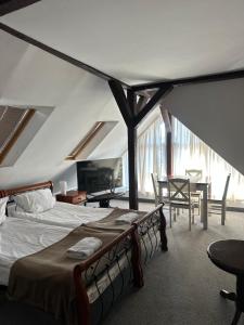 a bedroom with a bed and a table and chairs at Villa Rafa in Mielno +46 photos