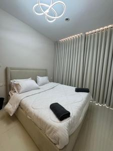 a bedroom with a large bed with a chandelier at elegant hotel studio Porto New Cairo pool access in Cairo +14 photos