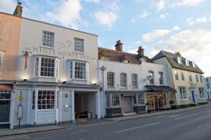 a row of buildings on a city street at White Horse in Maldon