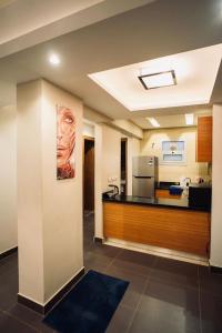 a room with a kitchen with a counter top at Modern apartment in Cairo