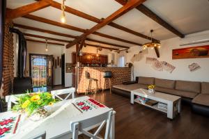 a living room with a couch and a table at La Mosie-Ruda in Ruda