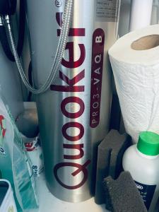 a can of coke next to a roll of toilet paper at Exklusives Heidehaus in Garlstorf mit Musikzimmer in Garlstorf +49 photos