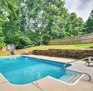 a swimming pool in a yard with a fence at Stunning Private Villa in Monroe with Pool in Monroe