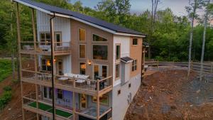 a house being built in the woods at Stay & Sway Lodge by American Patriot Getaways in Cartertown