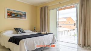 En eller flere senge i et værelse på Casa em Iguaba Grande com piscina 300m da lagoa