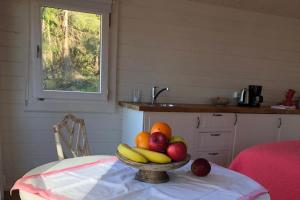 a bowl of fruit on a table in a kitchen at Lillstugan in Gustavsberg