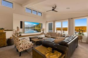a living room with a couch and a table at Henderson House in Saratoga