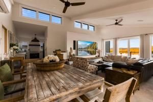 a living room with a wooden table and a couch at Henderson House in Saratoga