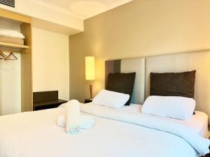 Ένα ή περισσότερα κρεβάτια σε δωμάτιο στο One bedroom Hospitality Suite